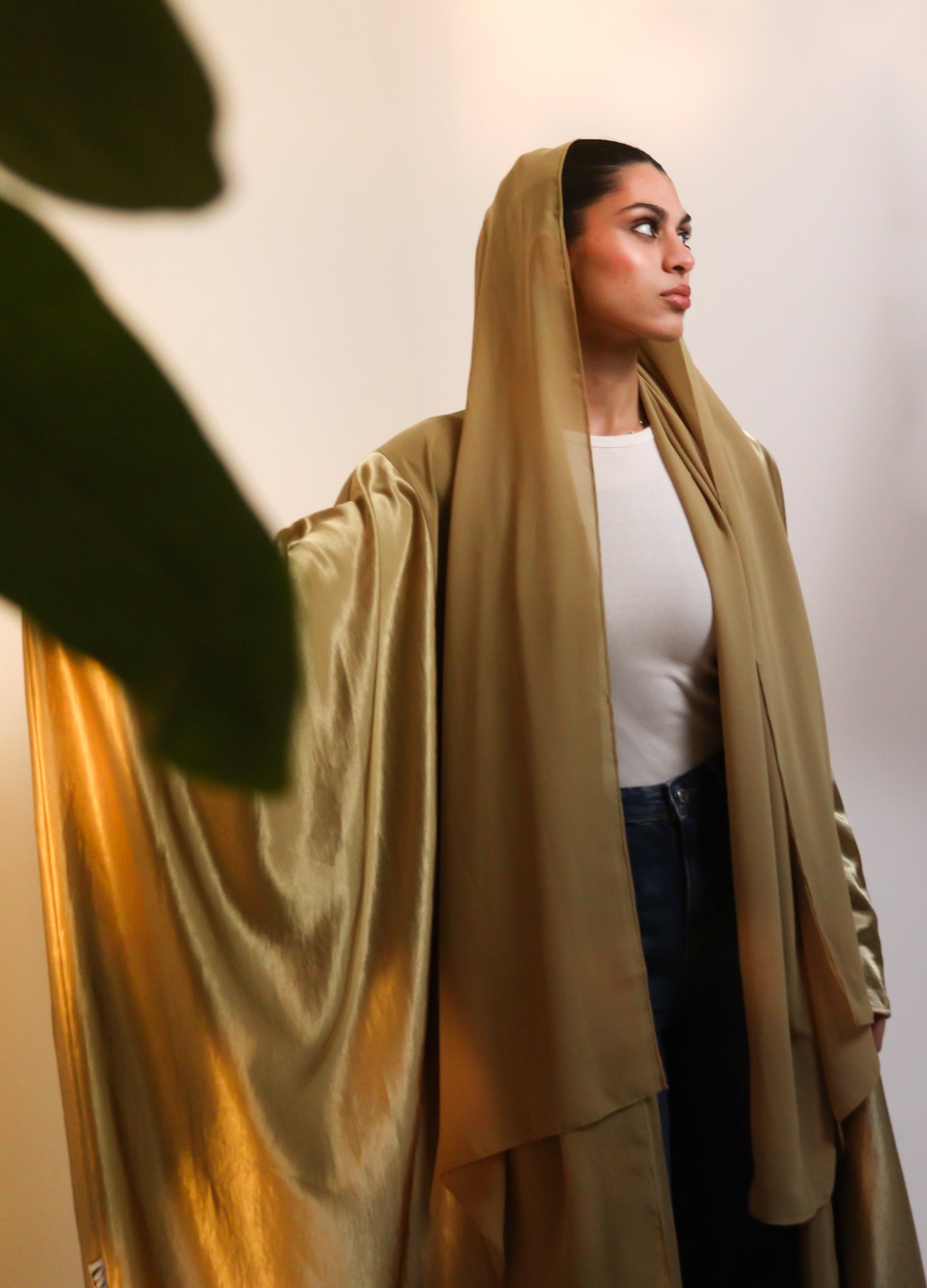 SHOROUQ, gold abaya, profile